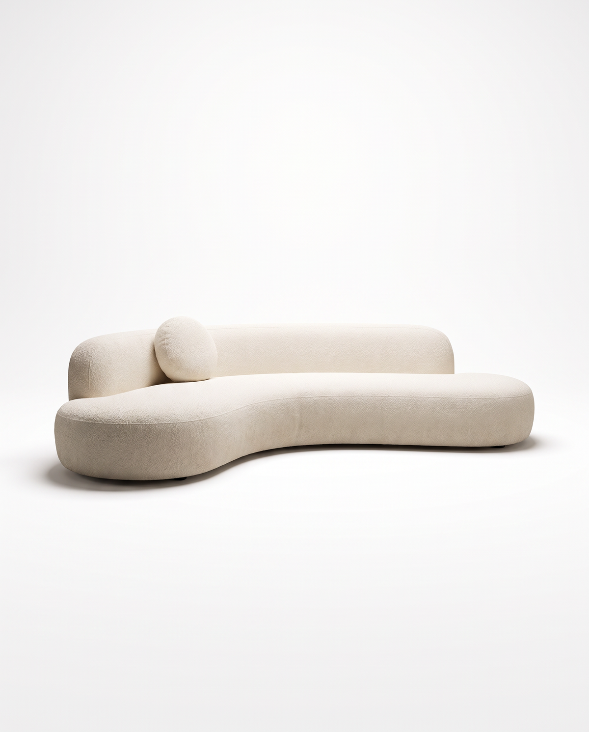 Mila Sculptural Bouclé Sofa in ivory bouclé, front studio view