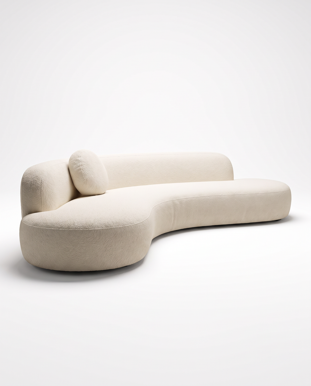 Mila Sculptural Bouclé Sofa in ivory bouclé, left three-quarter hero view
